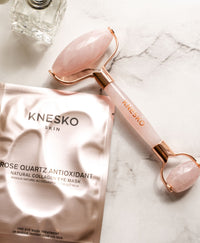 Rose Quartz Gemstone Roller alongside a Rose Quartz Antioxidant Eye Mask.