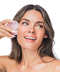 Lejla Cas using a Rose Quartz Gua Sha.